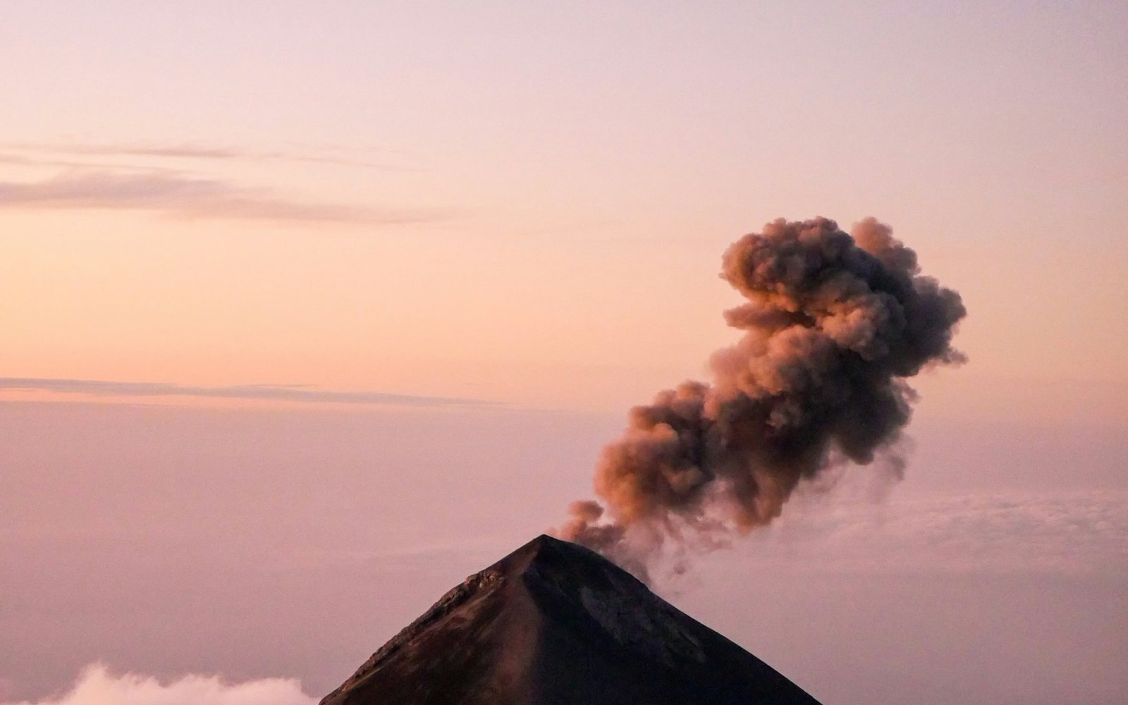Volcán de Fuego erupting at dusk